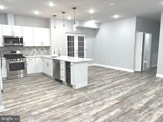 1237 Lancaster Avenue, Unit 1 Berwyn, PA 19312 - Photo 4 of 17 a kitchen with a stove a sink and a refrigerator