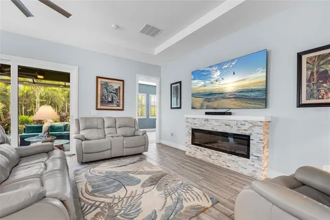 a bedroom with furniture and a chandelier