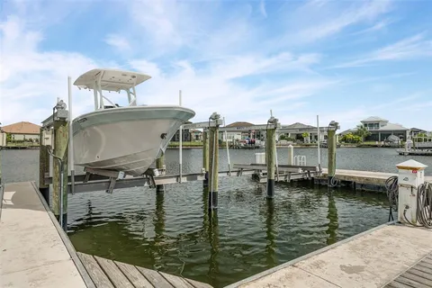 a view of a room with wooden floor and furniture