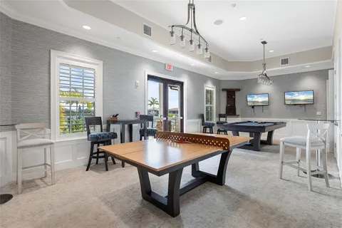 a view of a lake with a table and chairs