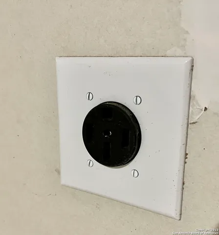 a front view of house with a garden