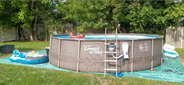 a front view of a house with a yard balcony