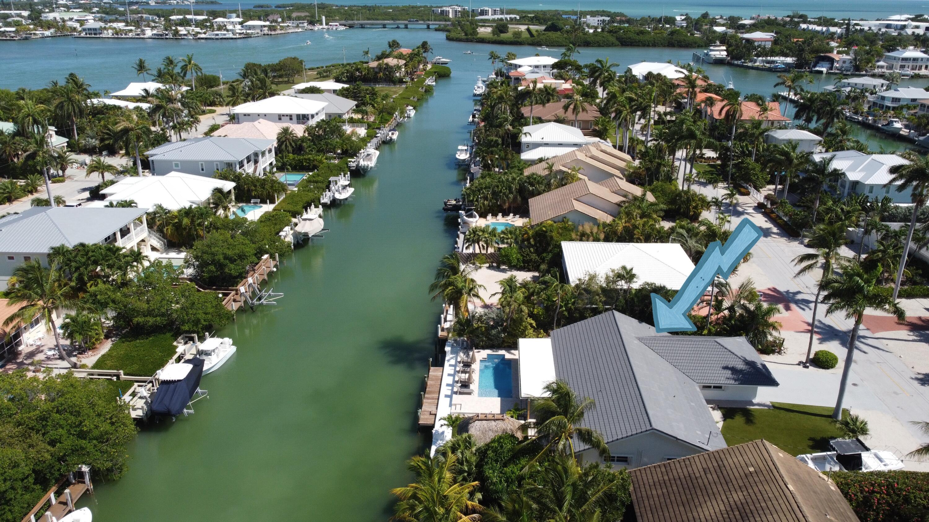 an aerial view of a house with a lake view