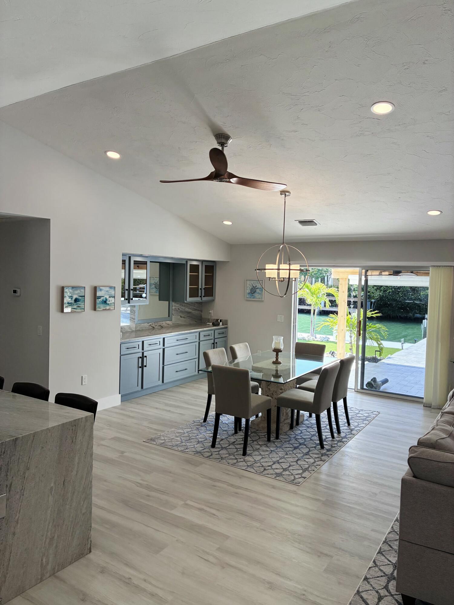 641 12th Street Key Colony Beach, FL 33051 - Photo 11 of 49 a view of a dining room with furniture window and outside view