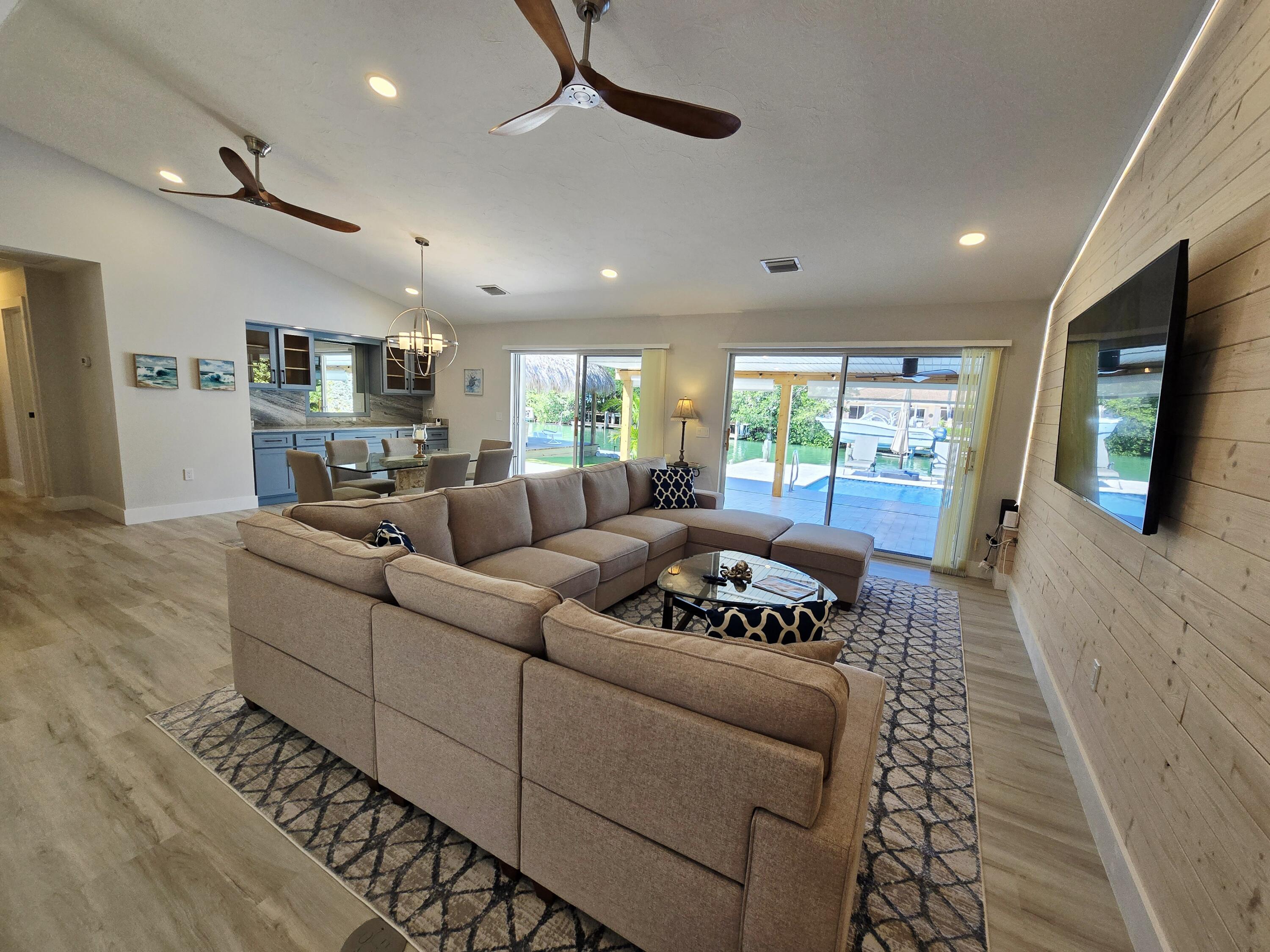 641 12th Street Key Colony Beach, FL 33051 - Photo 15 of 49 a living room with furniture and a flat screen tv