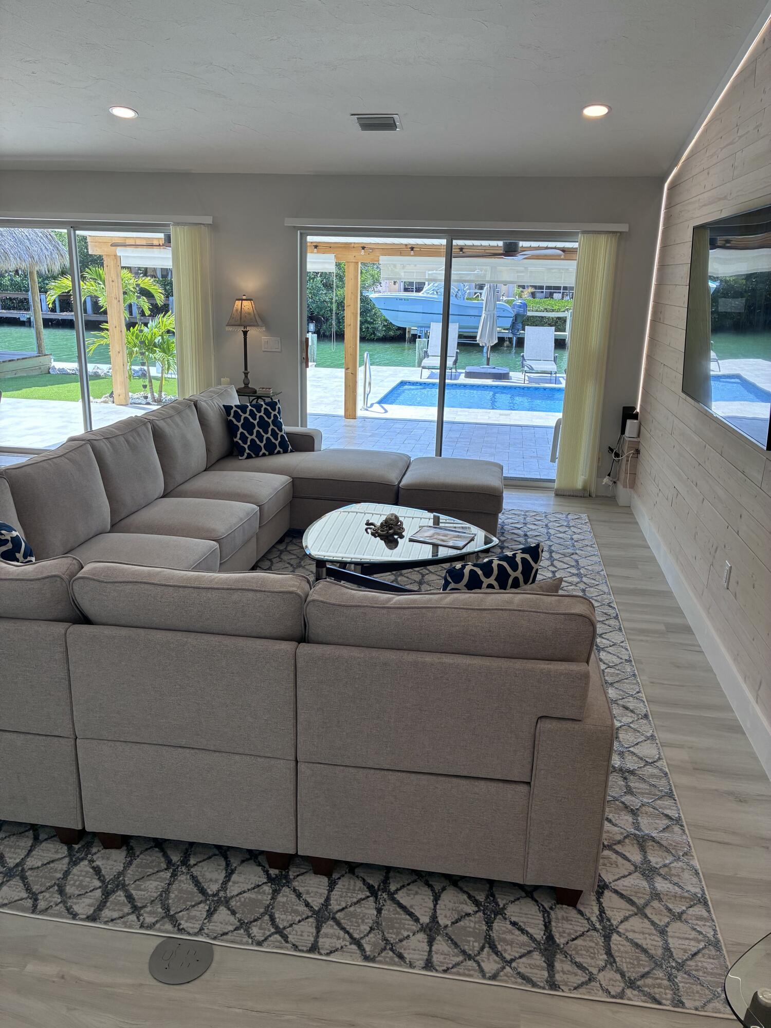 641 12th Street Key Colony Beach, FL 33051 - Photo 16 of 49 a living room with furniture and large windows