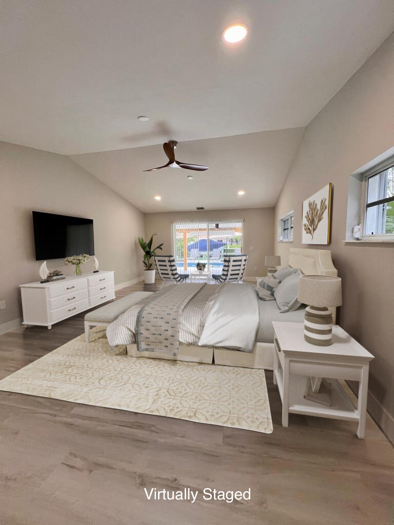 641 12th Street Key Colony Beach, FL 33051 - Photo 17 of 45 a living room with furniture and a flat screen tv