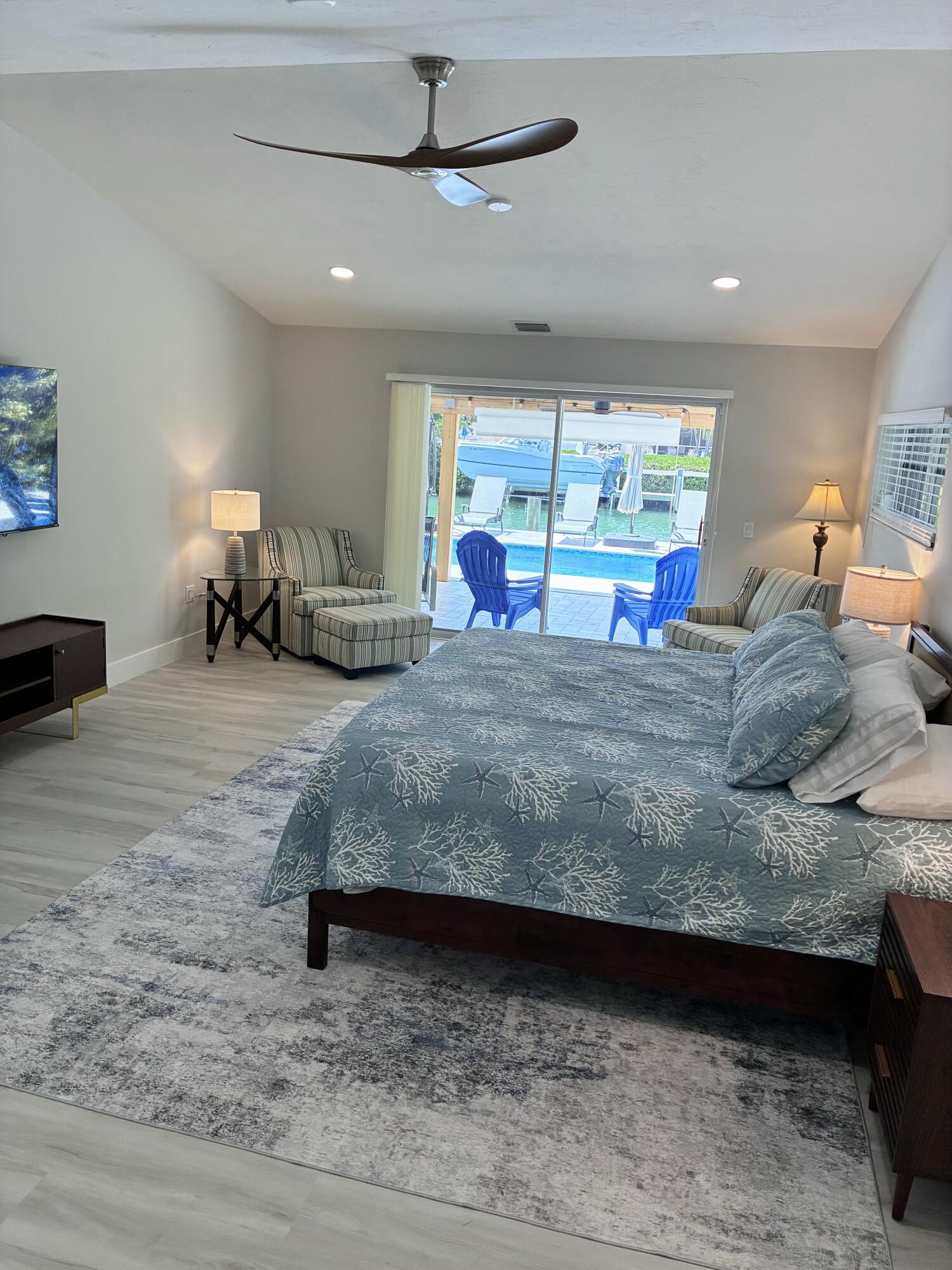 641 12th Street Key Colony Beach, FL 33051 - Photo 22 of 49 a room with a bed and a large window