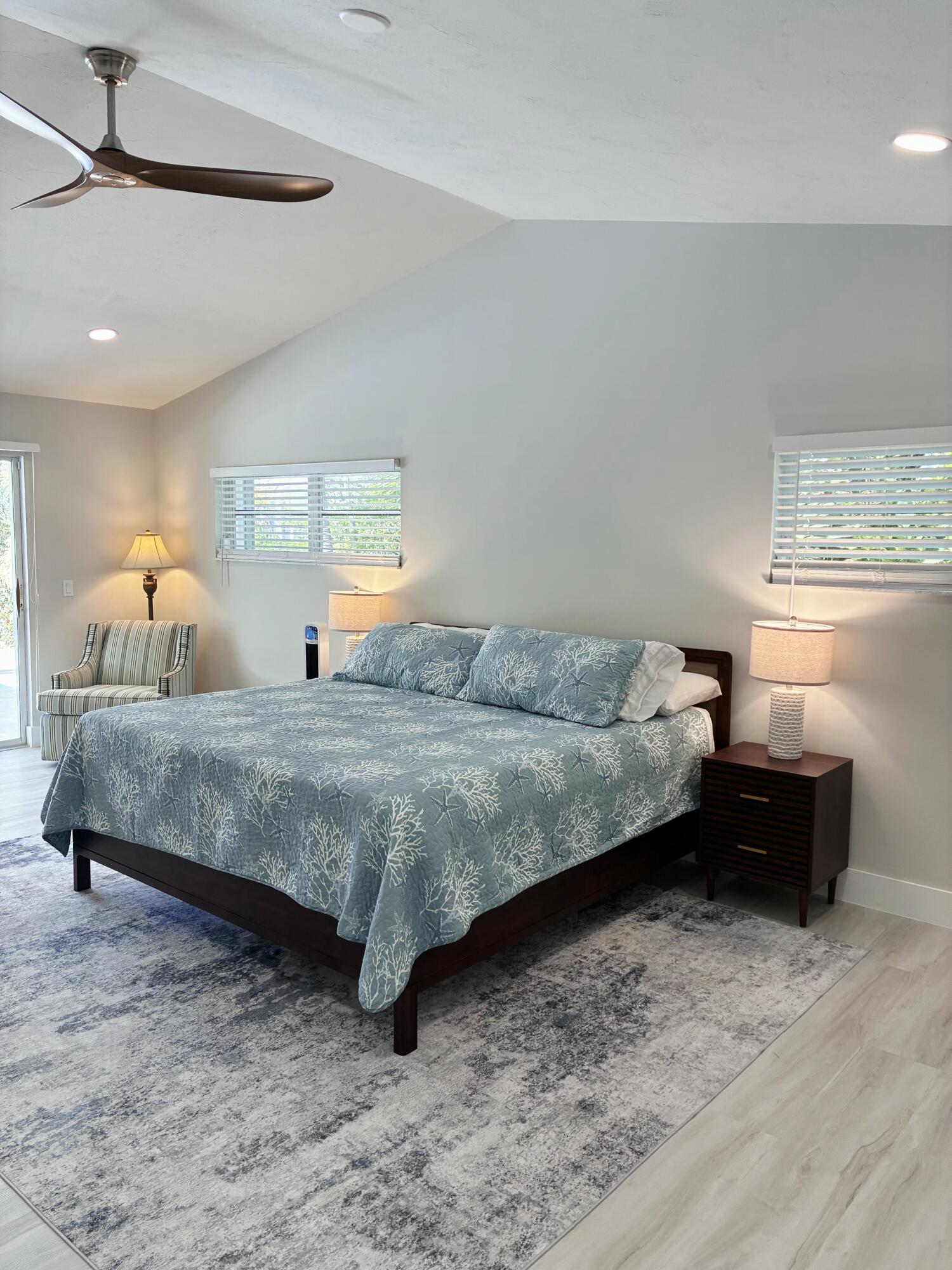 641 12th Street Key Colony Beach, FL 33051 - Photo 23 of 49 a bedroom with a bed and window