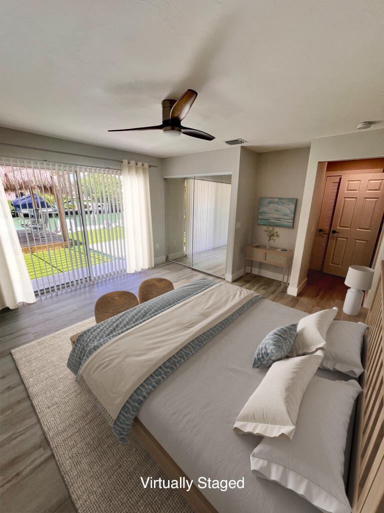 641 12th Street Key Colony Beach, FL 33051 - Photo 27 of 45 a bedroom with a bed and a large window