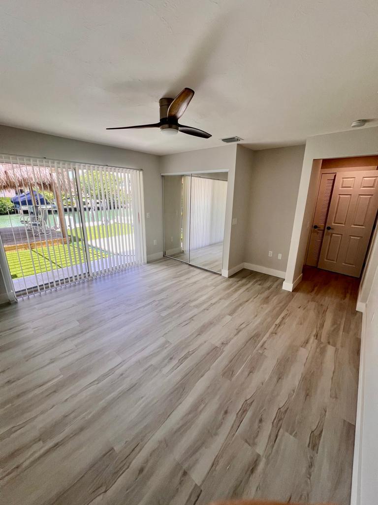 641 12th Street Key Colony Beach, FL 33051 - Photo 28 of 45 wooden floor in an empty room with a window