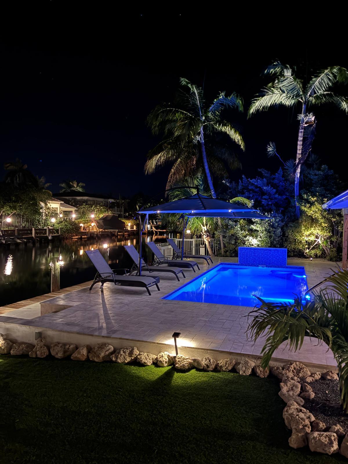 641 12th Street Key Colony Beach, FL 33051 - Photo 3 of 45 a view of a swimming pool with an outdoor seating