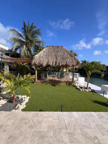 a view of a swimming pool with lounge chair