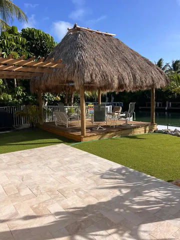 a front view of multiple houses with yard