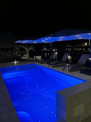 a area with pool table and chairs