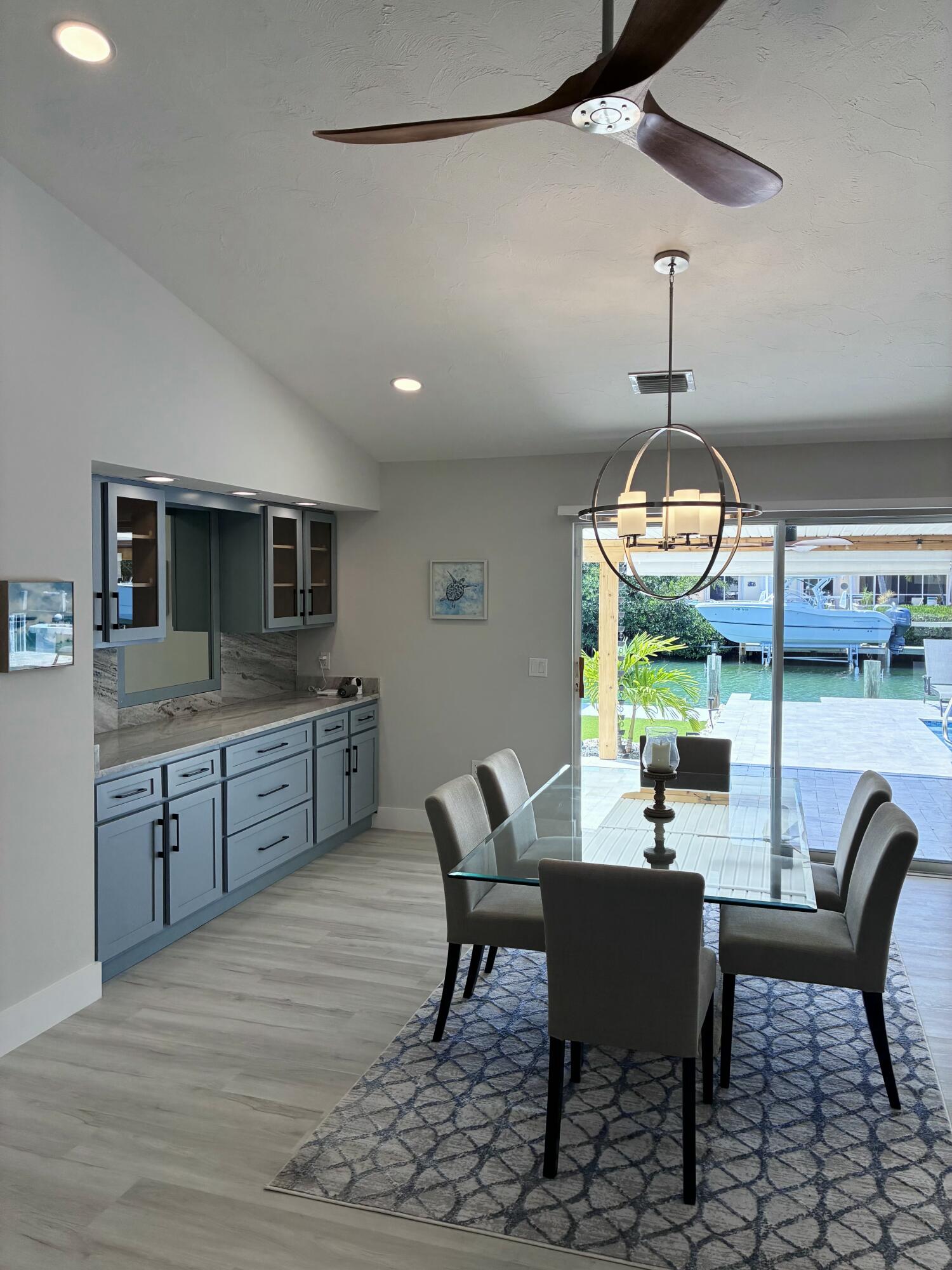 641 12th Street Key Colony Beach, FL 33051 - Photo 10 of 49 a view of a dining room with furniture window and wooden floor