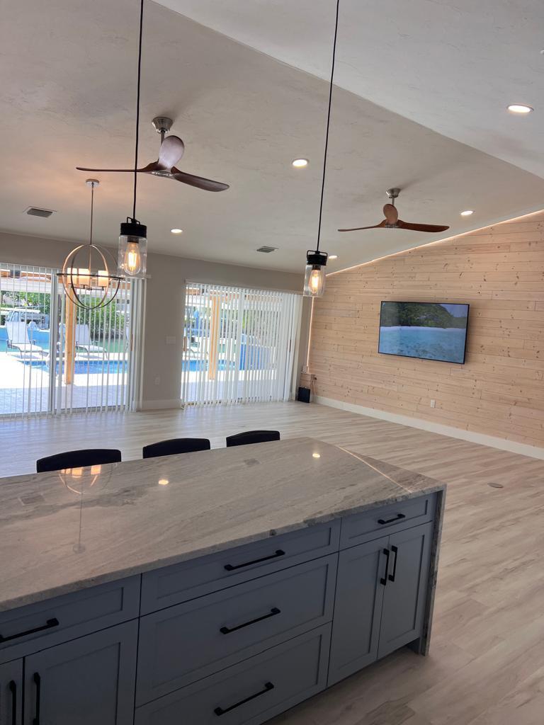641 12th Street Key Colony Beach, FL 33051 - Photo 10 of 45 a bathroom with a granite countertop sink a large mirror and vanity