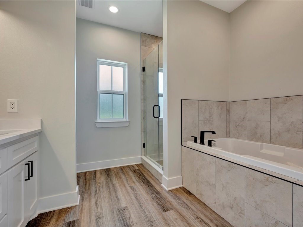 529 C C Road Diboll, TX 75941 - Photo 18 of 35 a bathroom with a bathtub and shower