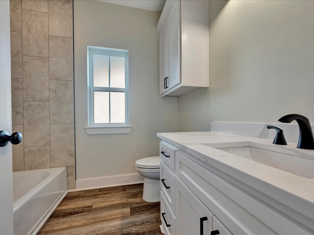 529 C C Road Diboll, TX 75941 - Photo 23 of 35 a bathroom with a sink a toilet and bathtub