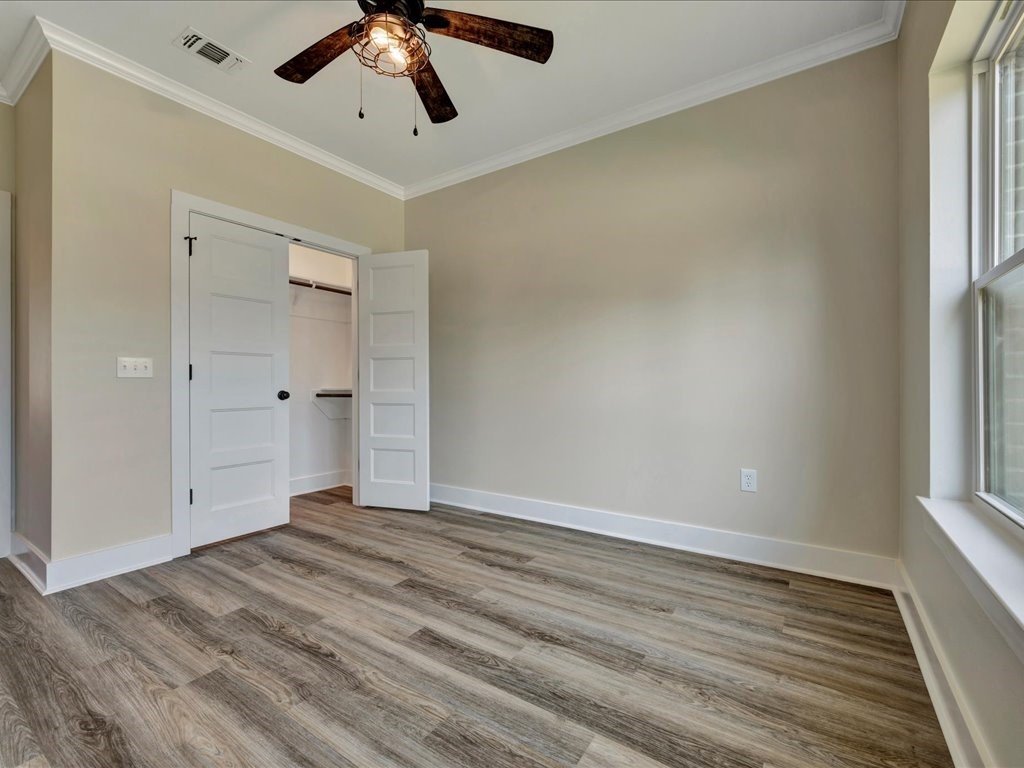 529 C C Road Diboll, TX 75941 - Photo 24 of 35 a view of empty room with wooden floor and fan
