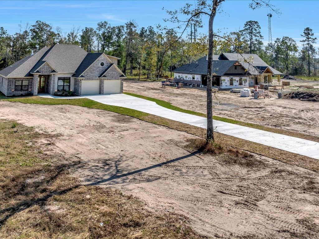 529 C C Road Diboll, TX 75941 - Photo 31 of 35 a view of a house with a yard