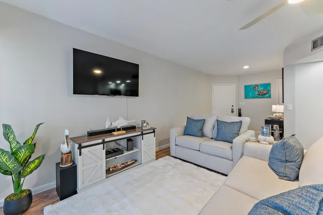 a living room with furniture white walls and white walls
