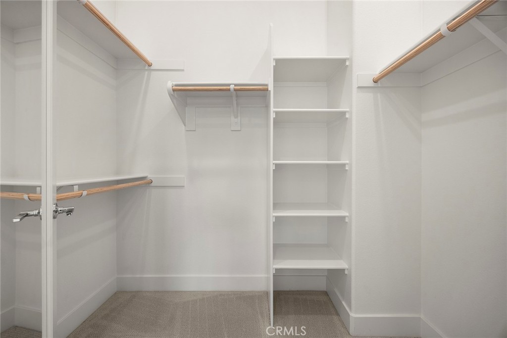 124 Tiffin Irvine, CA 92618 - Photo 18 of 26 a view of walk in closet with empty racks