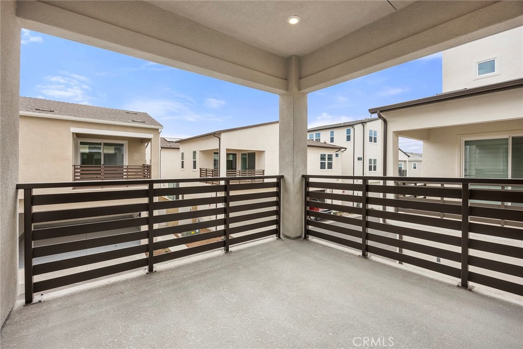 124 Tiffin Irvine, CA 92618 - Photo 19 of 26 a view of an empty room with stairs and a ceiling fan