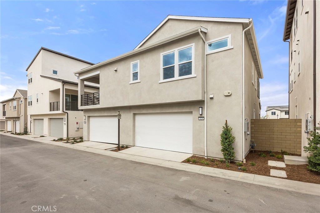 124 Tiffin Irvine, CA 92618 - Photo 23 of 26 a front view of a house with a street