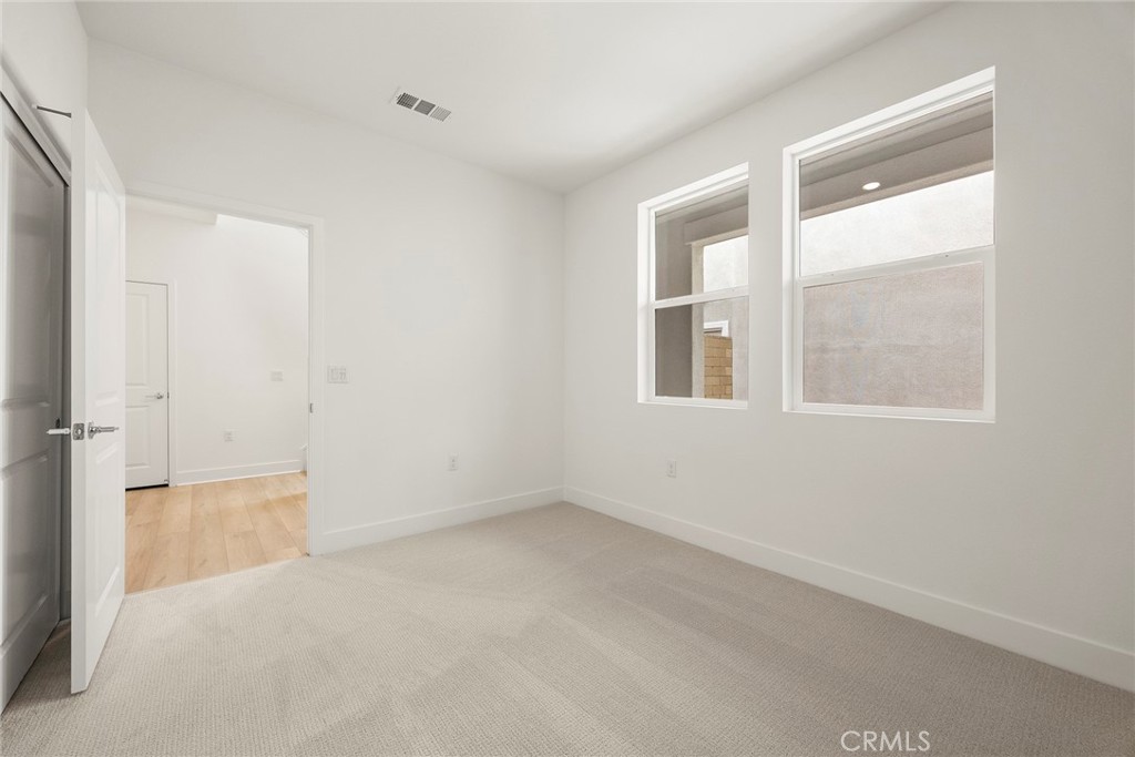 124 Tiffin Irvine, CA 92618 - Photo 3 of 26 an empty room with a window