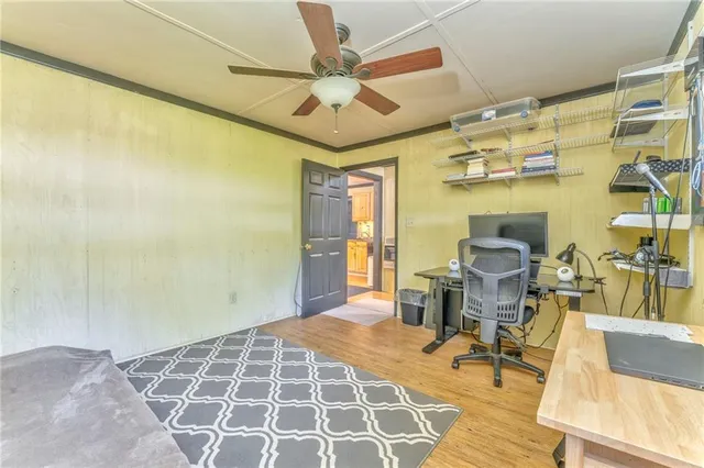 a spacious bedroom with two beds and a large window
