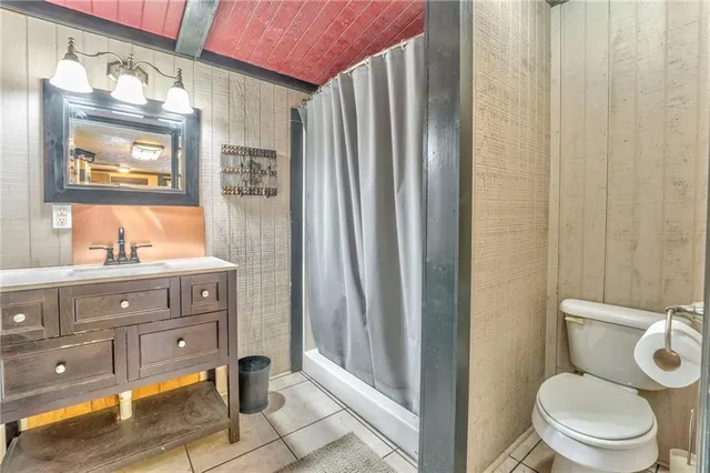 a room with a sink and a mirror