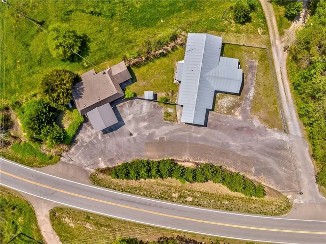 a front view of a house with a yard and a garage