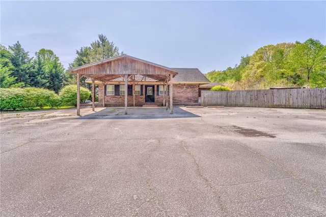 a view of a hall with wooden floor