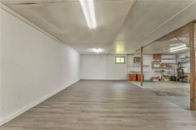 a view of a hallway with seating area