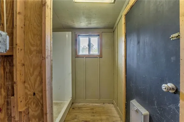 a room with storage and a white roof