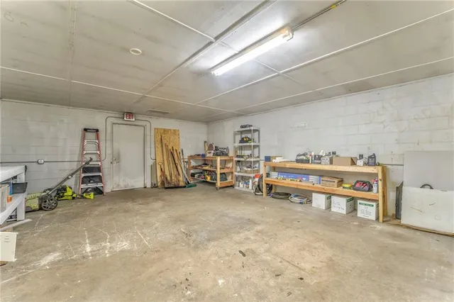 a view of a hall with wooden floor
