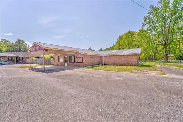 a view of swimming pool with an outdoor seating and a garden