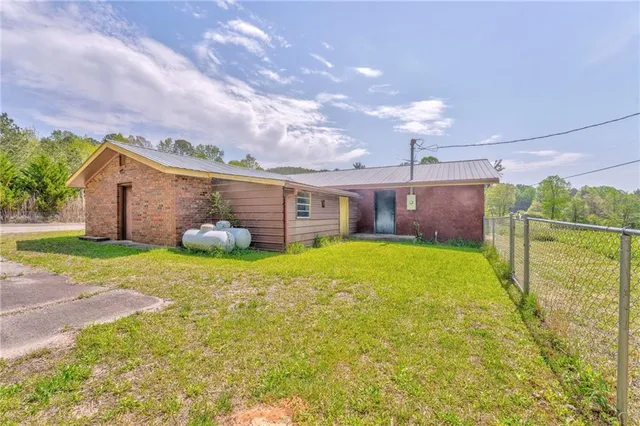 a view of swimming pool with a back yard