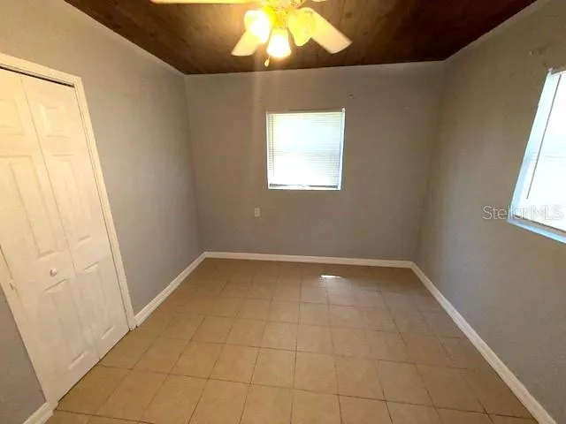 a view of an empty room and window