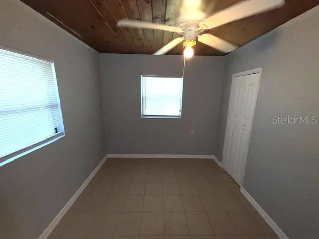 a view of an empty room with a window