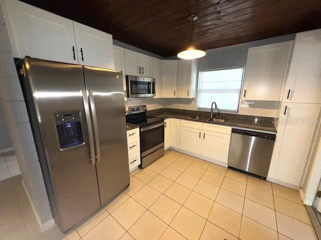 340 Mosley Road Lake Alfred, FL 33850 - Photo 2 of 13 a kitchen with stainless steel appliances granite countertop a sink a stove a refrigerator and cabinets