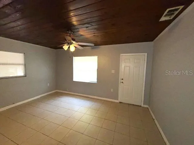 a view of an empty room with a window