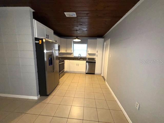 340 Mosley Road Lake Alfred, FL 33850 - Photo 7 of 13 a kitchen with stainless steel appliances granite countertop a refrigerator and a sink