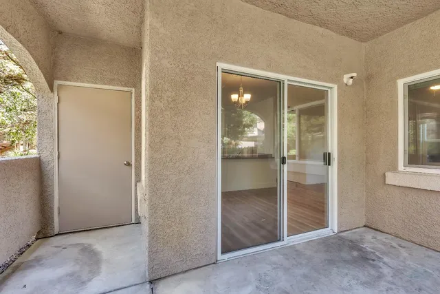 a kitchen with a refrigerator and a sink