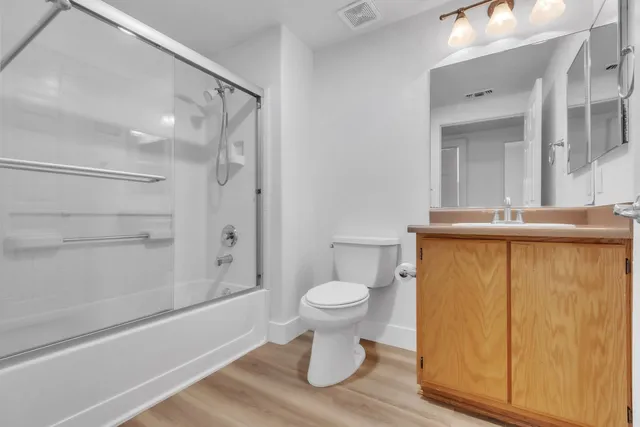 a bathroom with a toilet and a shower