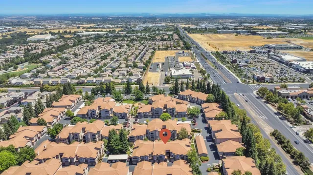 an aerial view of a house with a swimming pool