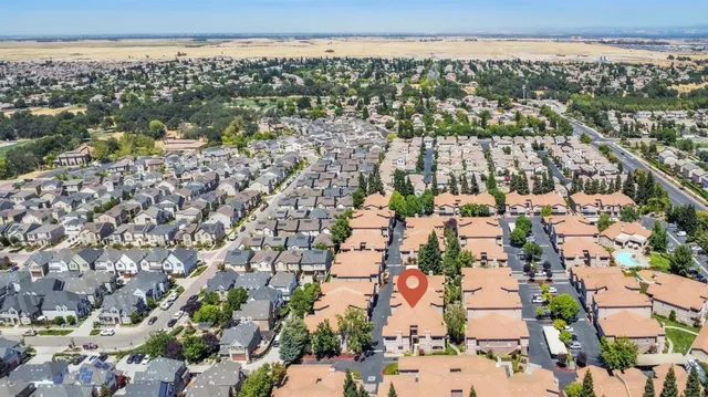 an aerial view of a house with outdoor space