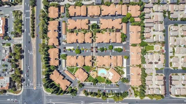 a view of a car parked in front of a house