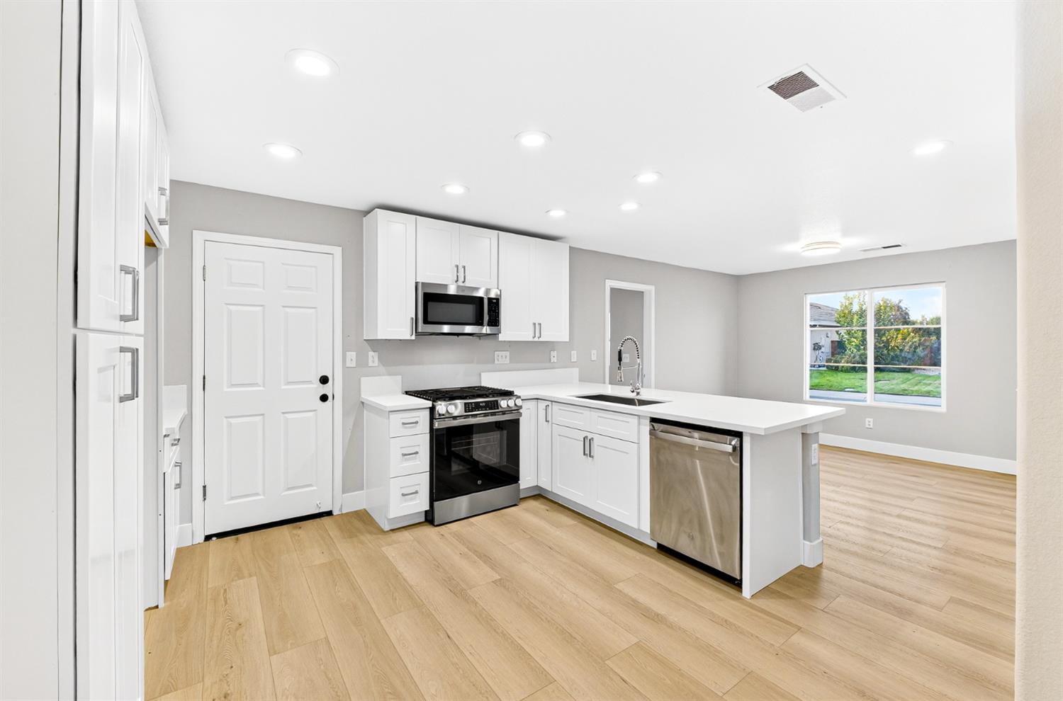 7481 Splendid Way Elk Grove, CA 95758 - Photo 11 of 41 a kitchen with stainless steel appliances granite countertop a stove a sink and a refrigerator